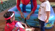 Spiderman children pumping water balloons - Video of colorful balloons