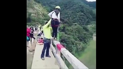 Shocking moment bungee jumper crashes head first into shallow river from 50ft bridge because rope wa