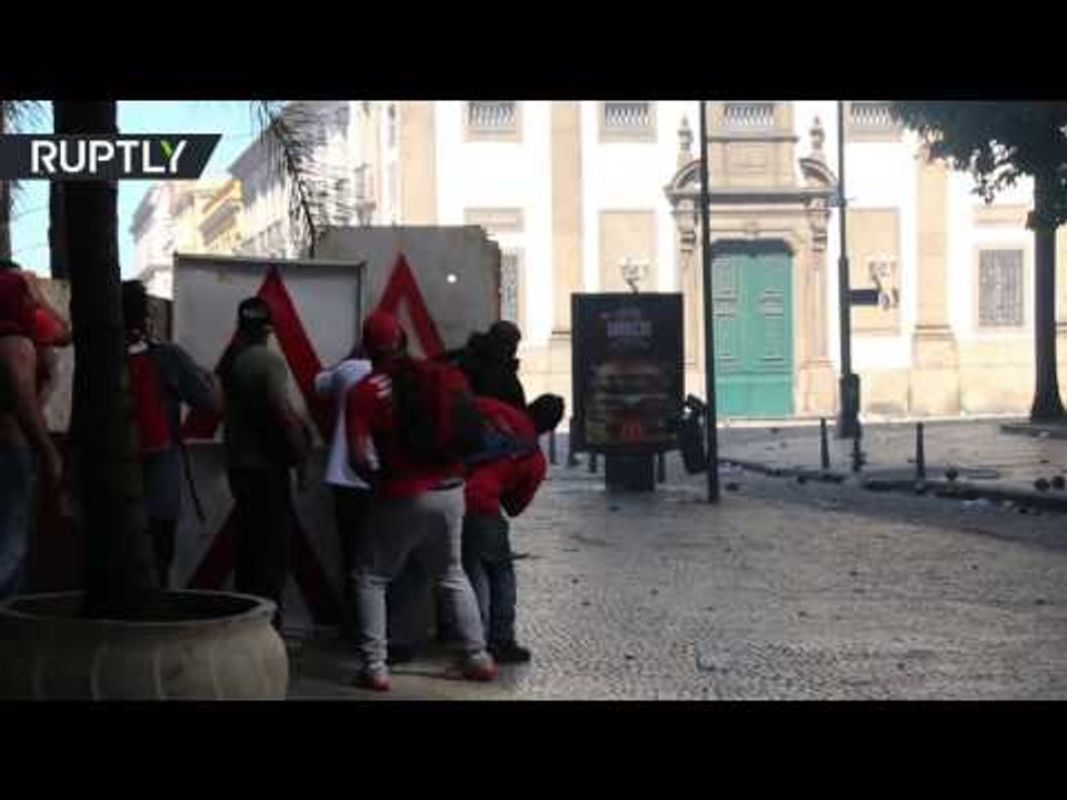 Rio police clashes with protesters, at a time when authorities vote on new austerity measures