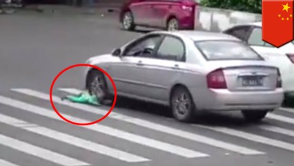 Baby falls out of vehicle and is almost run over on busy street in China