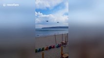 Military helicopters training over the sea