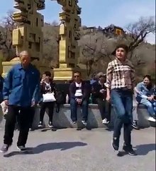 Old Man And Young Girl Dancing In Public Place