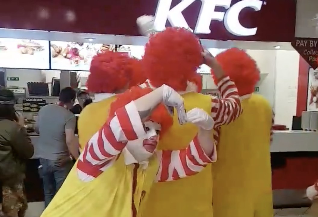 Men Dressed as Ronald McDonald Really Don't Like KFC