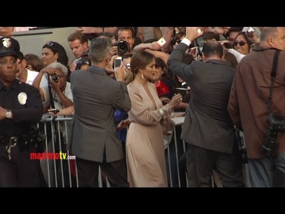 Jennifer Lopez Greets FANS at "What to Expect When You're Expecting" Premiere
