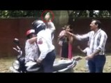 Delhi Traffic Cop attacks woman with brick