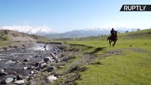 Wakeboarder Races Through River Rapids Pulled by Horse