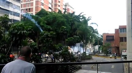 Caracas Protesters Flee Charging Police Truck