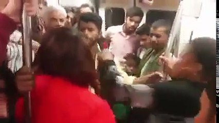 WATCH!! Nigerian Woman Pulls Off Her Dress Inside Public Bus To Fight Dirty An India Man!! (Viral Video)