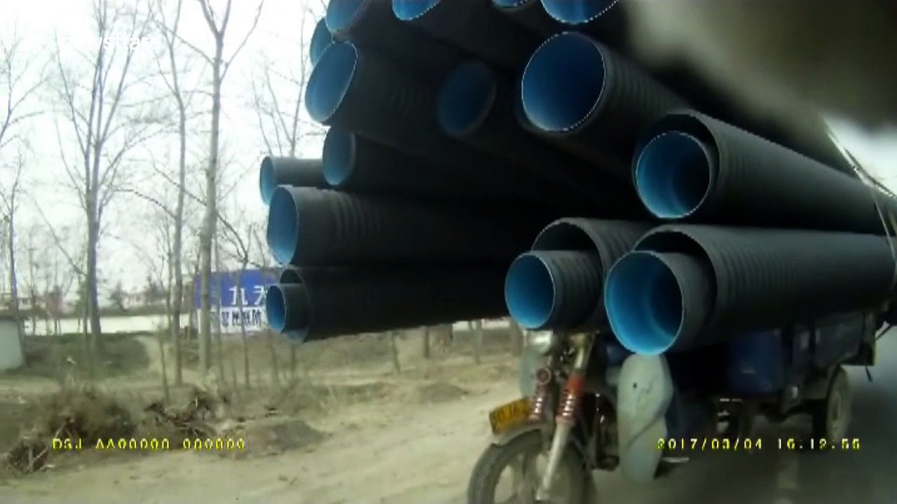 Man rides insanely overloaded motorbike on busy road