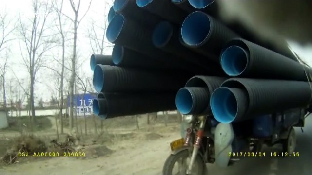 Man rides insanely overloaded motorbike on busy road