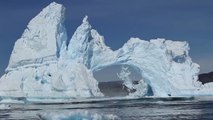 Tourists Watch An Iceberg Bridge Collapse In Greenland