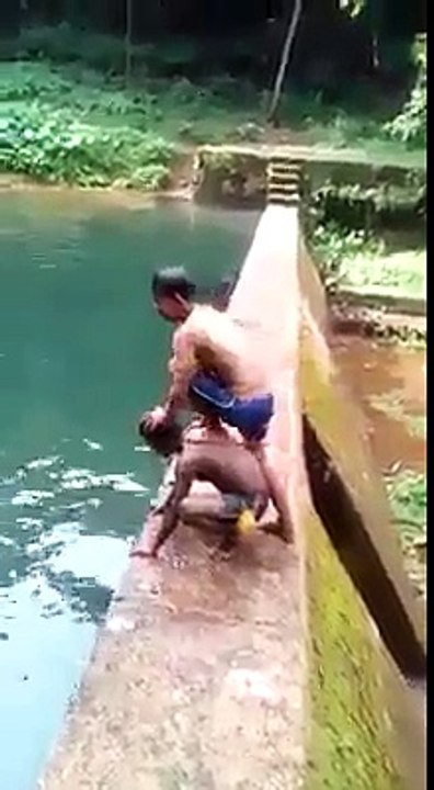 funny boys jumping on the river