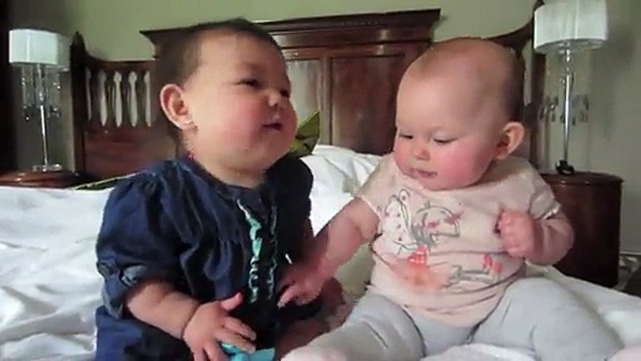 Both cute baby is playing happily