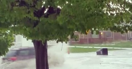 Download Video: Garbage Can Floats Down Flooded Denver Street