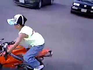 Amazing skills by a little boy on a mini bike