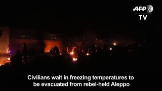Civilians wait to be evacuated from rebel-held Alep