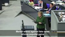 Merkel warns against fake news driving populist gains-ONPqwe2423