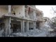E. Damascus Suburb Heavily Damaged Following Air Raids, Ground Combat