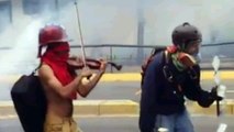 Violinist plays through tear gas during Venezuelan protests