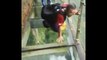 Frightened tourists on a glass bridge in China