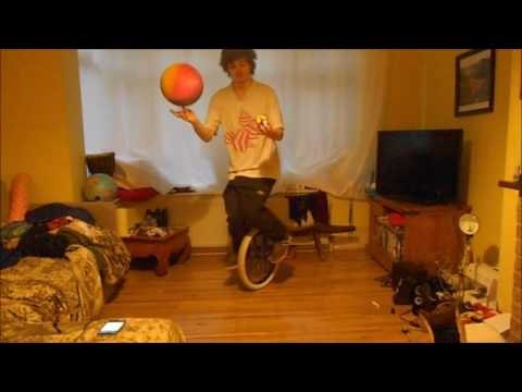 Man on Unicycle Spins Basketball While Simultaneously Solving Rubik's Cube