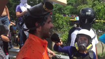 Gas Mask-Clad Opposition Leader Denounces Violence, Bolsters Caracas Protesters