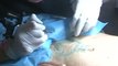 This tattoo artist is covering up c-section scars [Mic Archives]