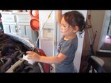 Young DIY Queen Demonstrates How to Change Oil
