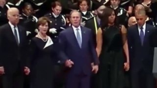 George W  Bush dances during the Dallas Memorial