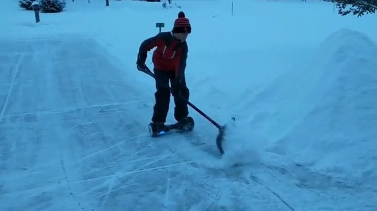 Clever Kid Uses Hoverboard Hack To Easily Plow Snow