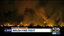 Fire departments battle overnight brush fire