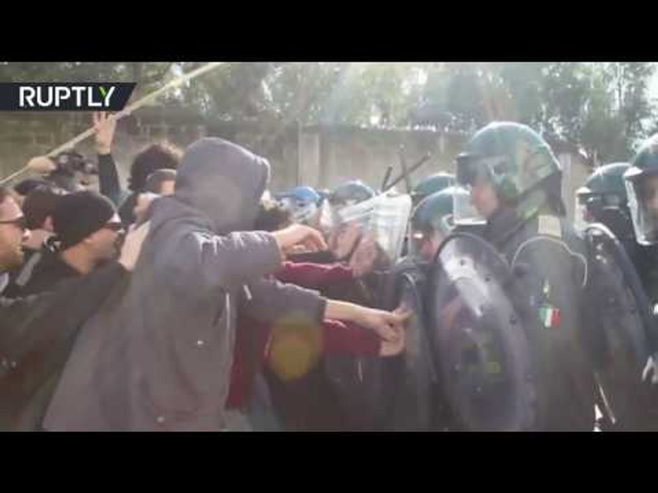 Protesters clash with police during Italian PM Matteo Renzi's visit to Naples