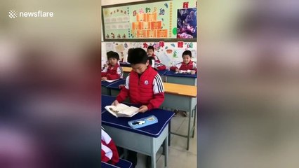 School boy gets emotional while reading out loud in class