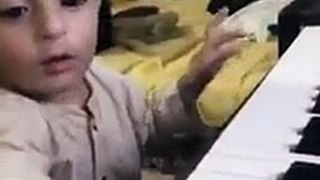 A cute 10 Months Baby Playing Horror Music on Piano