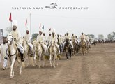 Hazrat Sultan Muhammad Ali Sahib leading the M H Sultania Awan Horse Club.