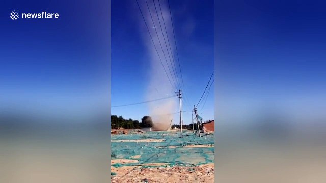 Dust devil blows down temporary house in Beijing