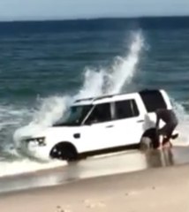 Man Shovels to Save SUV From Waves on New Jersey Beach