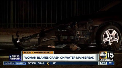 Woman blames crash on water main break