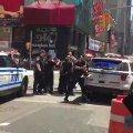 A motorist rushes on pedestrians in Times Square