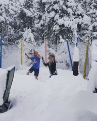 Nederland Residents Jump on Trampoline Buried Under Snow