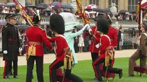 Queen presents new colours to Scots Guards