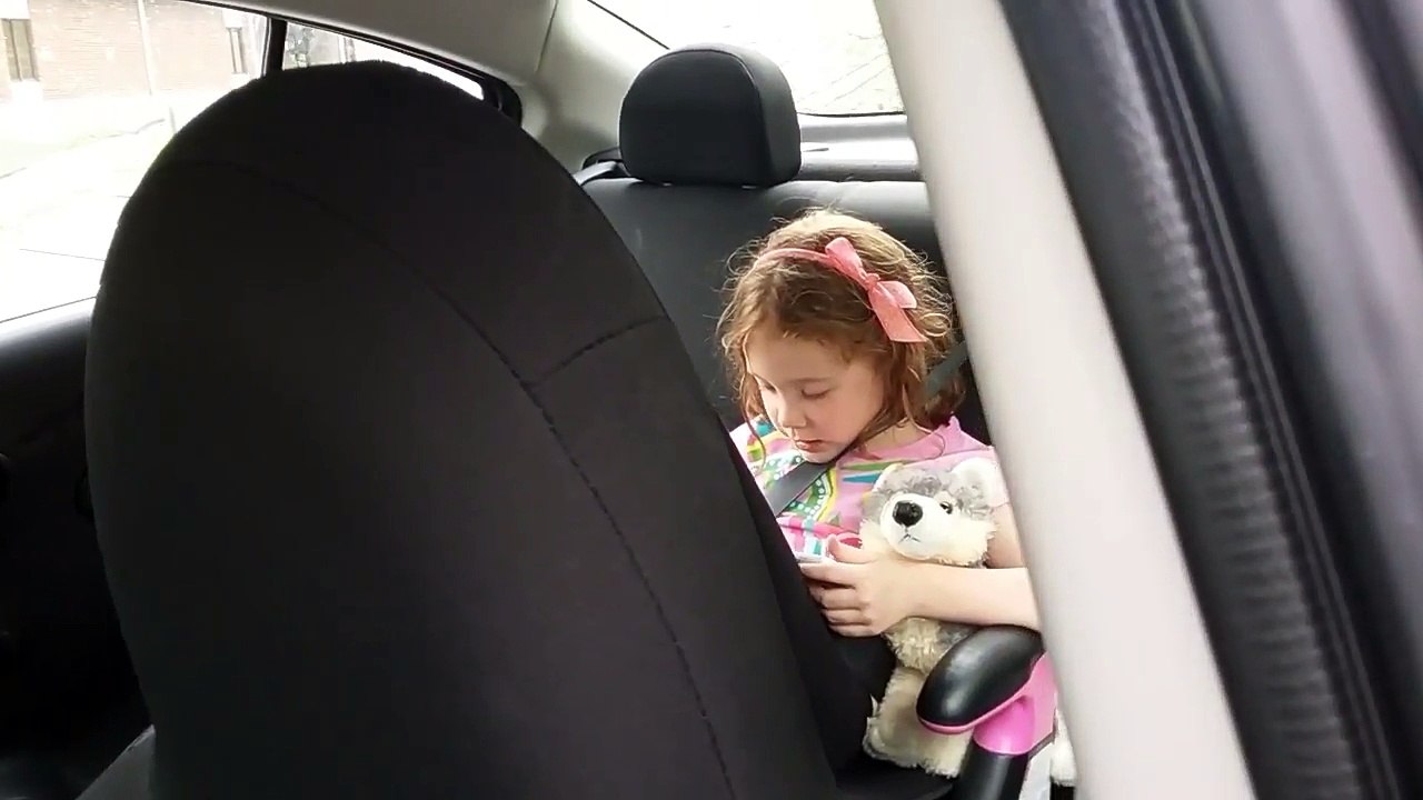 Little Kimmy Schmidt playing with her tablet