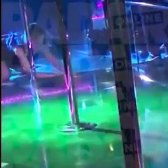 Jennifer Lawrence drunkenly pole-dances, strips off blouse, grinds with mystery man