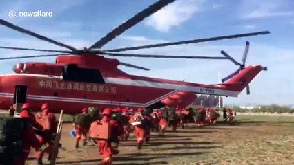 Firefighters battle huge forest fire in northern China