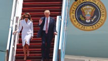 Melania Trump appears to push president’s hand away
