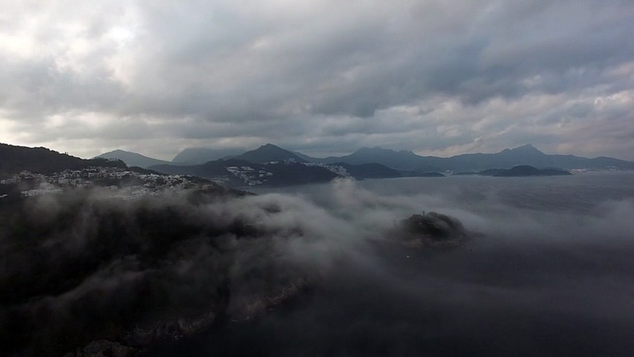 Flying Over Misty Coastline