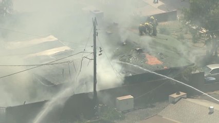 Firefighters battle large house fire in Tempe