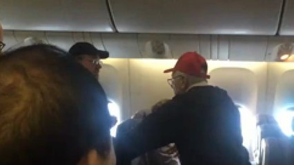 Download Video: Belligerent man wearing Trump hat kicked off United flight