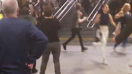 People run through Manchester's Victoria Station following explosions