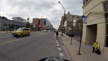 Motorcyclist turns right on red when we have right of way, cuts off cyclist in bike lane